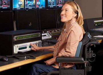 Picture of a wheelchair castor wheel with a play icon