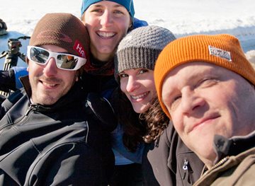 People looking at a Social Media page on a tablet.